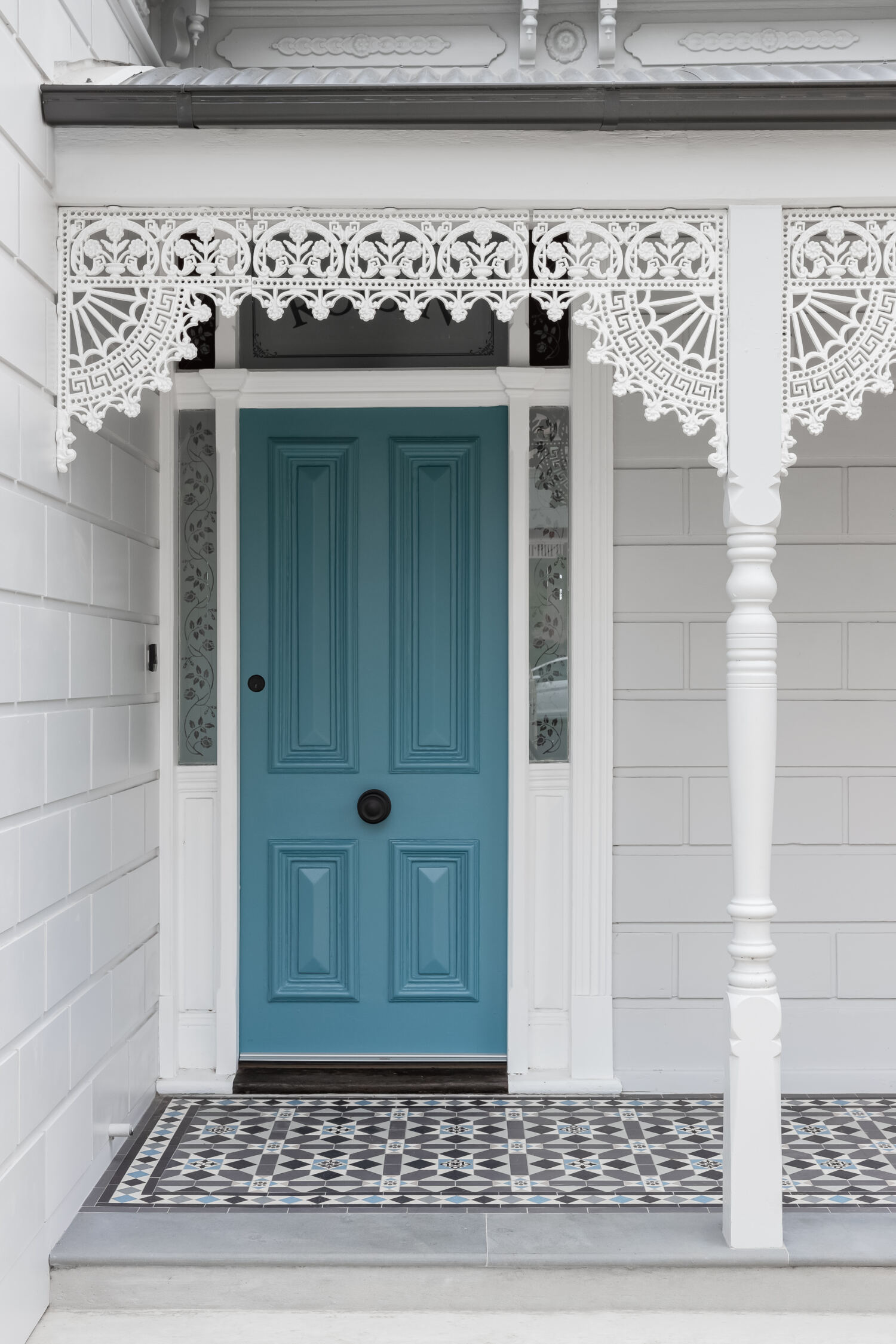 Turquoise Front Door with lattice work