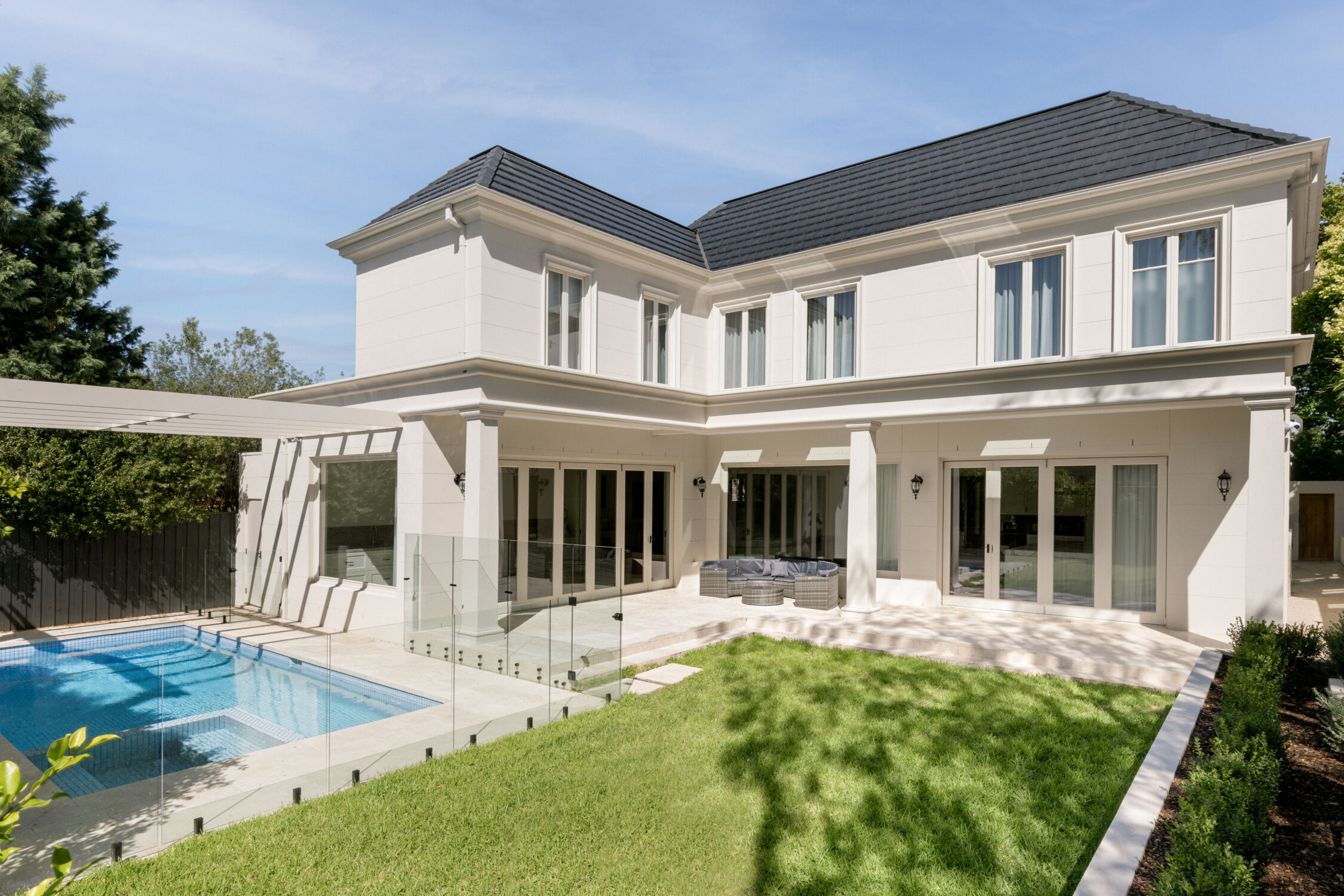 Rear Exterior French Provincial Home with Pool